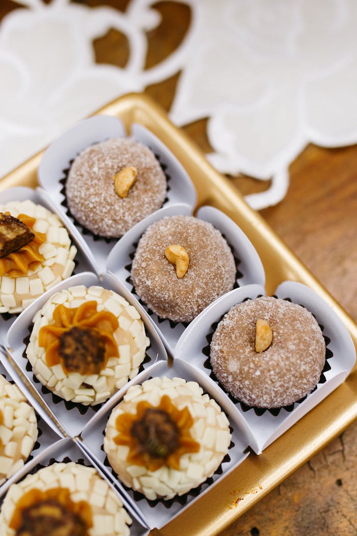 Close-up of beautifully arranged Brazilian brigadeiros in a decorative box, perfect for celebration.